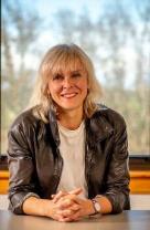 A photographic portrait of Dr. Martine Béland with a window in the background